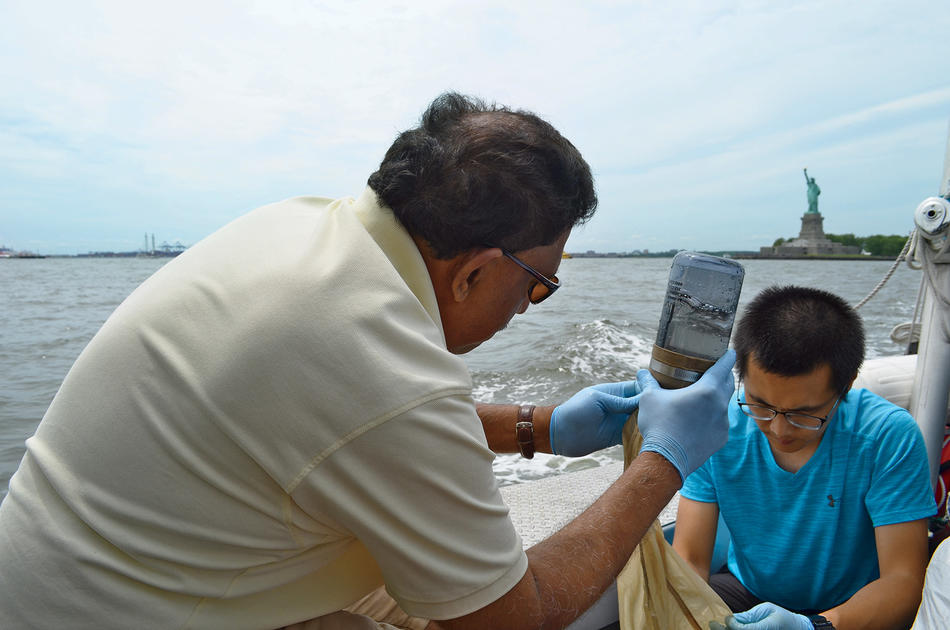 Columbia Lamont Doherty Earth Observatory's Joaquim Goes and visiting scholar Ye Li filtering water in New York Harbor