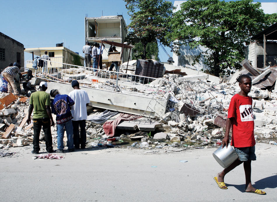 People sifting through rubble in downtown Port-au-Prince after the 2010 Haitian earthquake