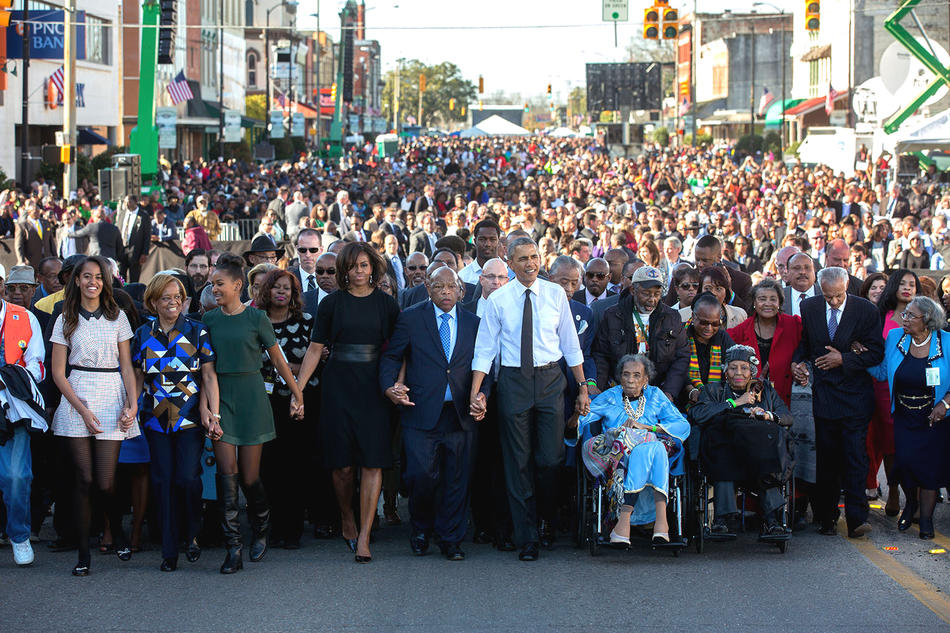 The Obama family with Georgia congressman John Lewis in a walk across the Edmund Pettus Bridge in Selma, Alabama, on March 7, 2015.