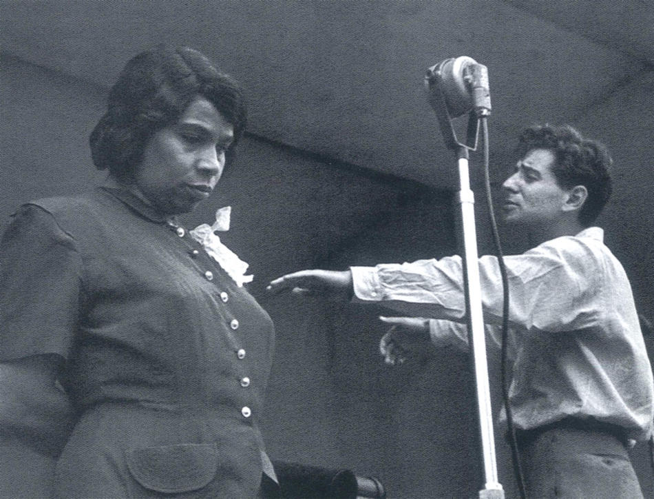 Leonard Bernstein conducts contralto Marian Anderson and the New York Philharmonic during a 1947 rehearsal at Lewisohn Stadium. (NY Philharmonic Archives)