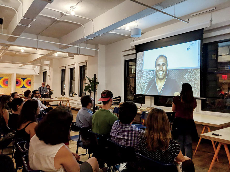 An Iraq-based Syrian refugee speaks at a NaTakallam event