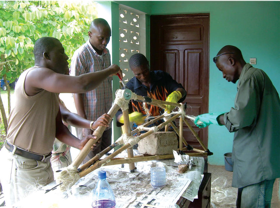 Craftsmen in Accra, Ghana learning how to build bicycle frames out of bamboo