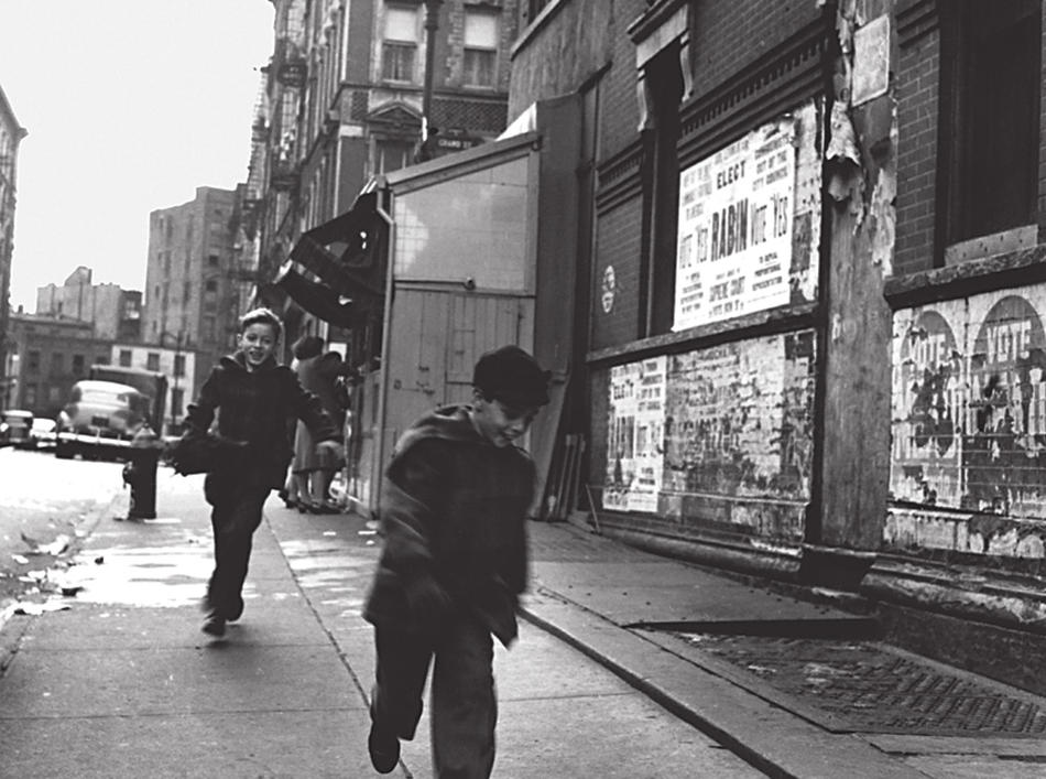 Photo of  boys playing in the street in the Lower East Side, by Rebecca Lepkoff