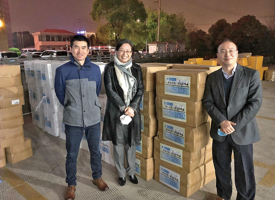 Jianfei Zhu, Yuan Wang, and Yimei Lu from the Columbia Alumni Association prepare a shipment of PPE in Shanghai to send to Columbia University Irving Medical Center