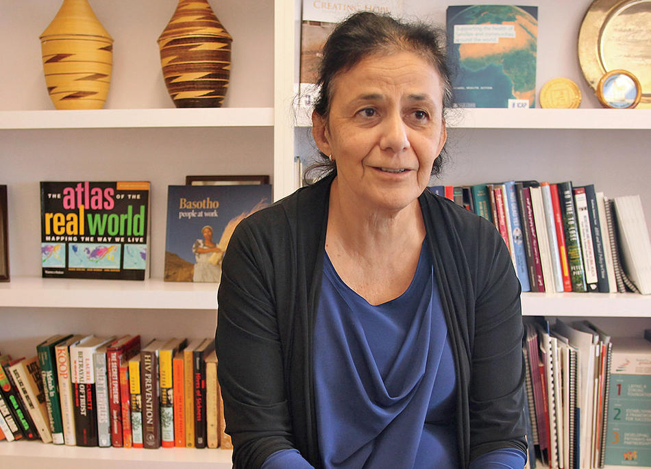 Columbia epidemiologist Wafaa El-Sadr in front of bookshelf 