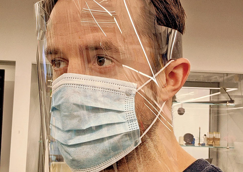 A man wearing a COVID-19 face shield produced by Columbia Engineering