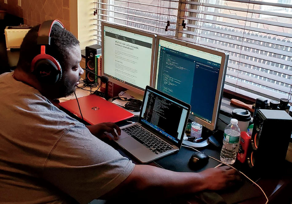  Antwan Bolden, a graduate of the coding boot camp and current TA for the course, works at home in Jersey City.