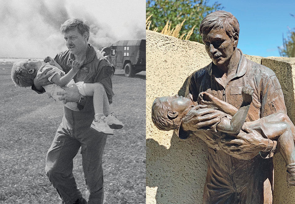 Photo of Spencer Bailey being carried to safety after a 1989 plane crash next to a bronze sculpture memorializing the event