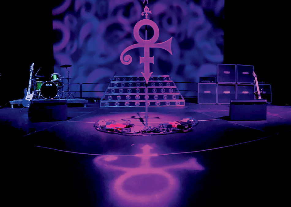 Prince’s microphone and instruments on display in the Soundstage exhibit at Paisley Park