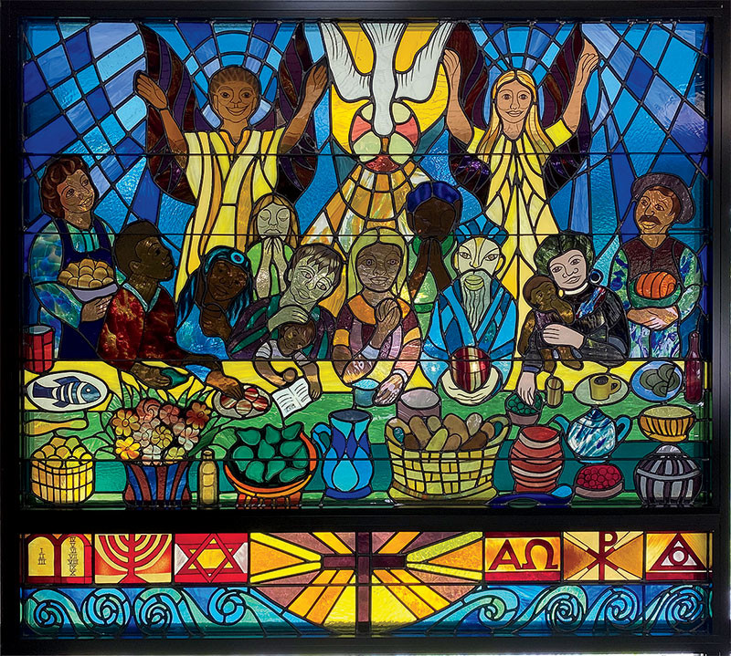 The Welcome Table, a stained-glass window in Redeemer Lutheran Church in Bangor, Maine, by artist Ashley Bryan