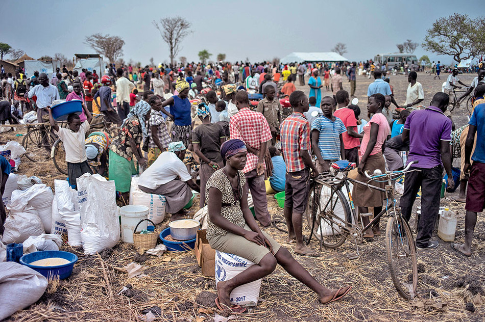South Sudanese refugees gathering at a camp in Uganda