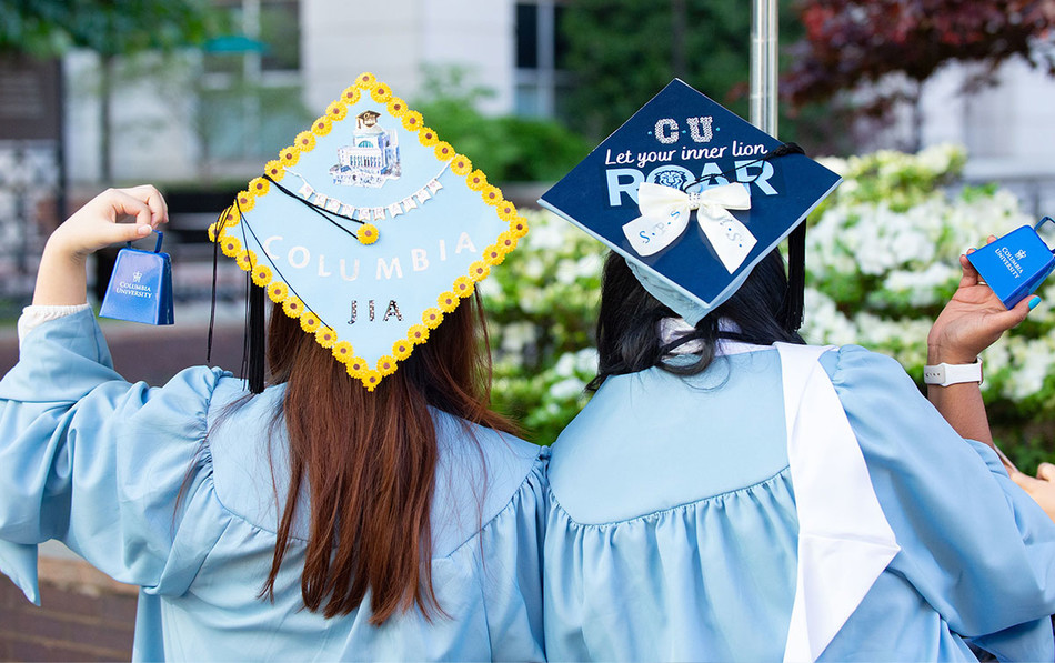 Columbia graduates wearing decorated caps at 2022 commencement