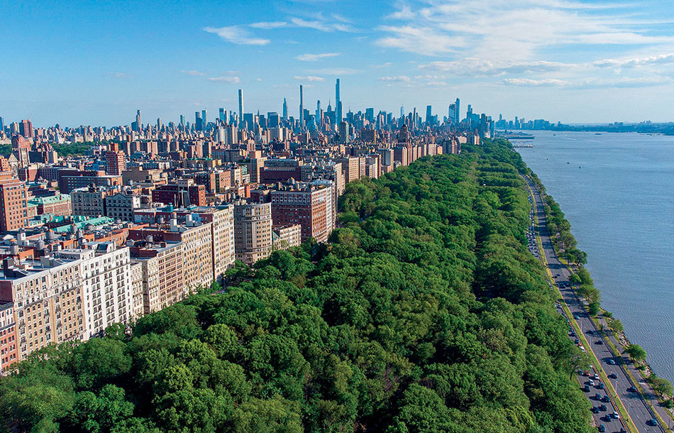 Overhead view shot of Riverside Park, West Side Highway, and Hudson River beside Columbia University campus
