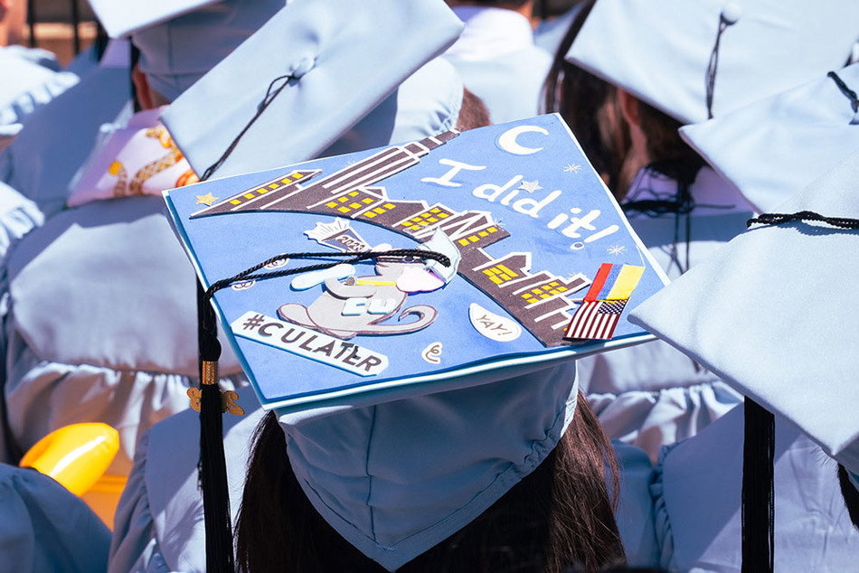 A Columbia graduate at 2023 commencement with a decorated cap