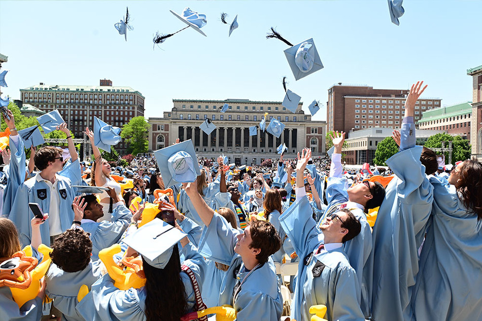 Columbia College graduates throwing up their caps at Columbia's 2023 Commencement ceremony