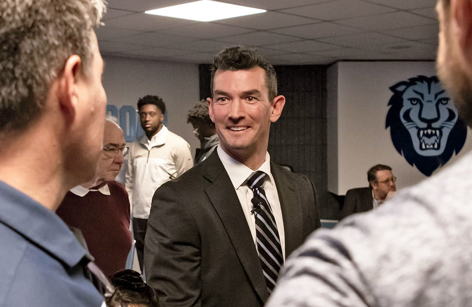 Football coach Jon Poppe appears at a Columbia press conference announcing his appointment in December