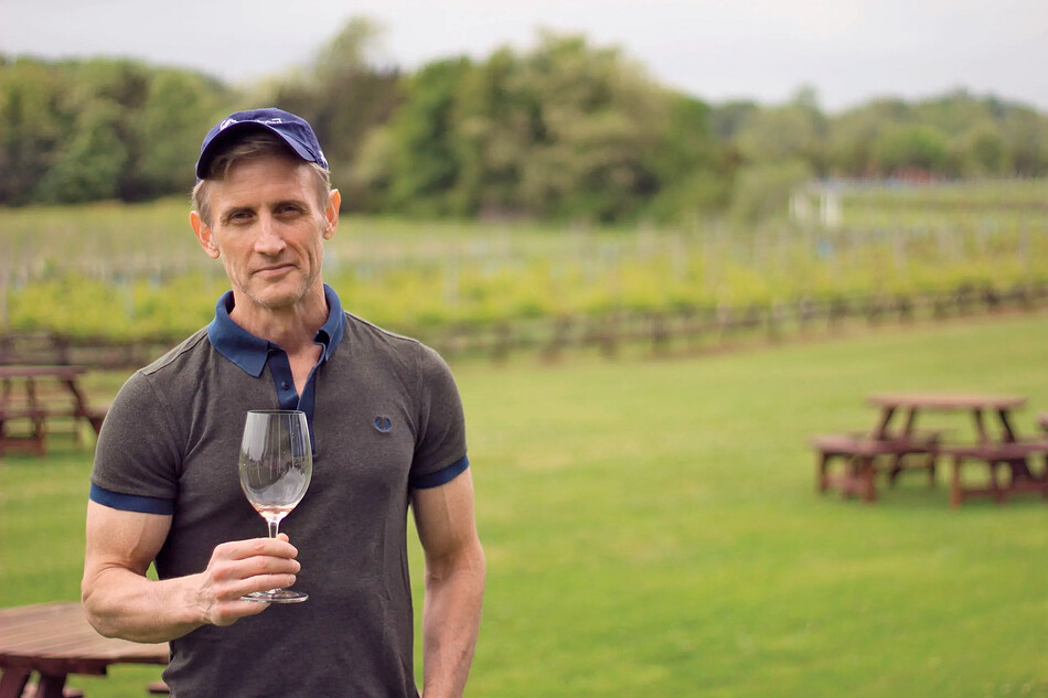 Dan Abrams holding a wine glass