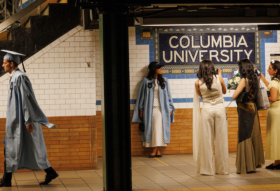 Columbia graduates on the subway during 2026 commencement