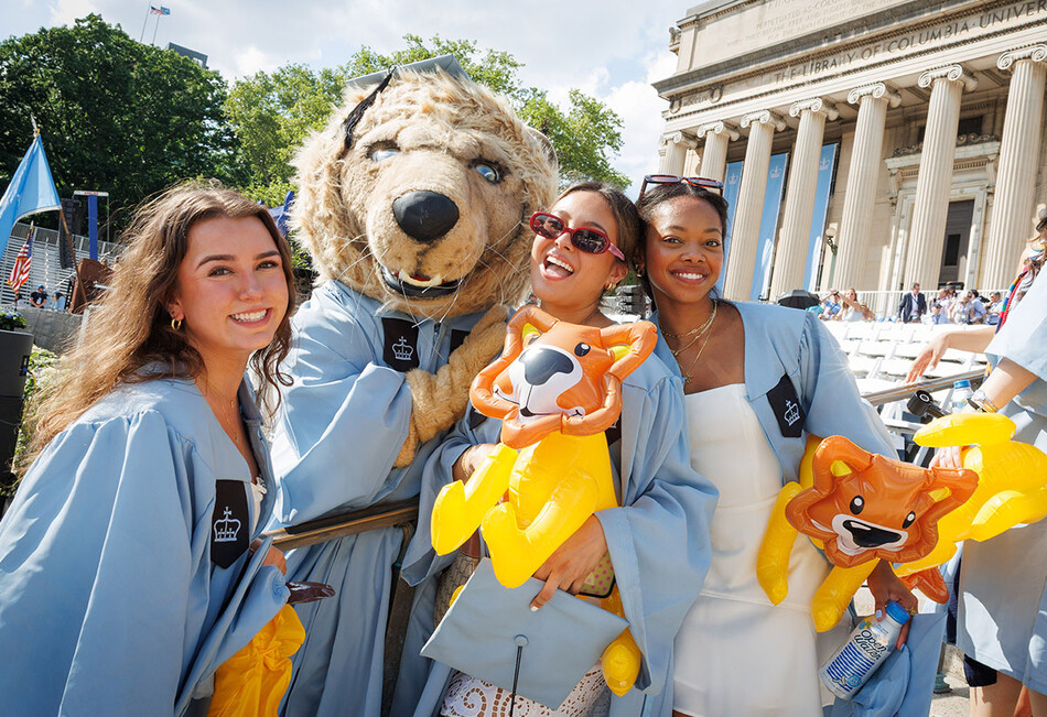 Columbia graduates with the Roar-ee mascot at 2026 commencement