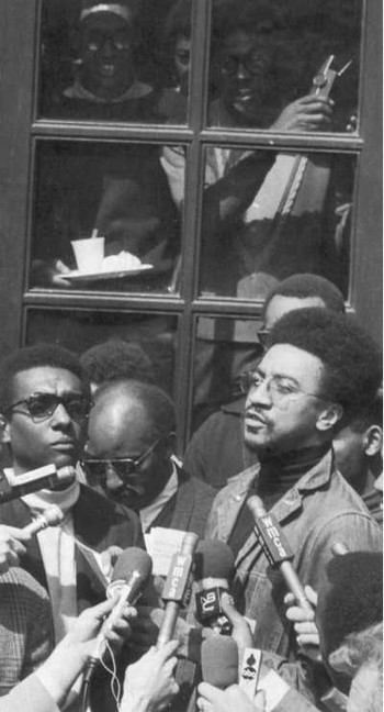  Hamilton’s Black Power co-author, Stokely Carmichael (a.k.a. Kwame Ture) (l), and fellow activist H. Rap Brown (r) talked to reporters outside Hamilton Hall, one of five Columbia University buildings occupied by students in April 1968.