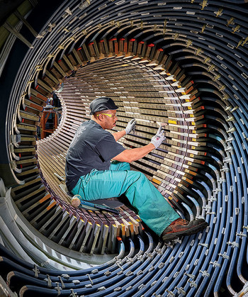 Worker inside a hydrogen-cooled generator at GE Gas Power, Schenectady, New York