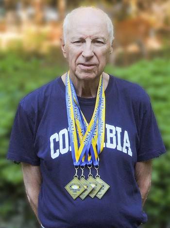 Robert Gamer wearing medals from the Empire State Senior Games